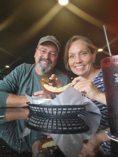 pic of couple sharing a pretzel Helen, GA