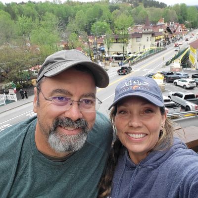 pic of couple with Helen, GA in background