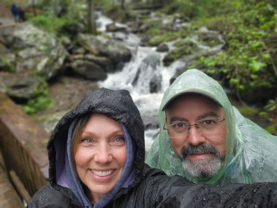 pic of couple in front of stream